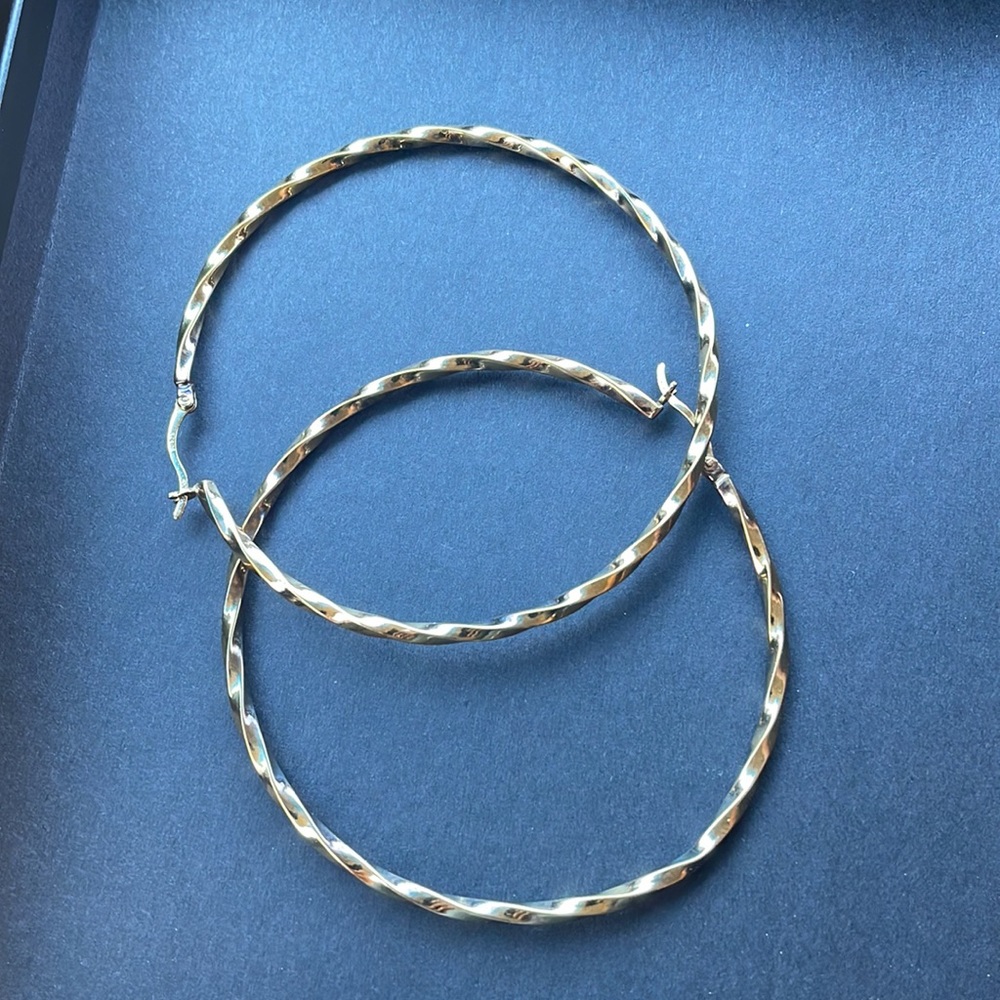 Gold earrings.